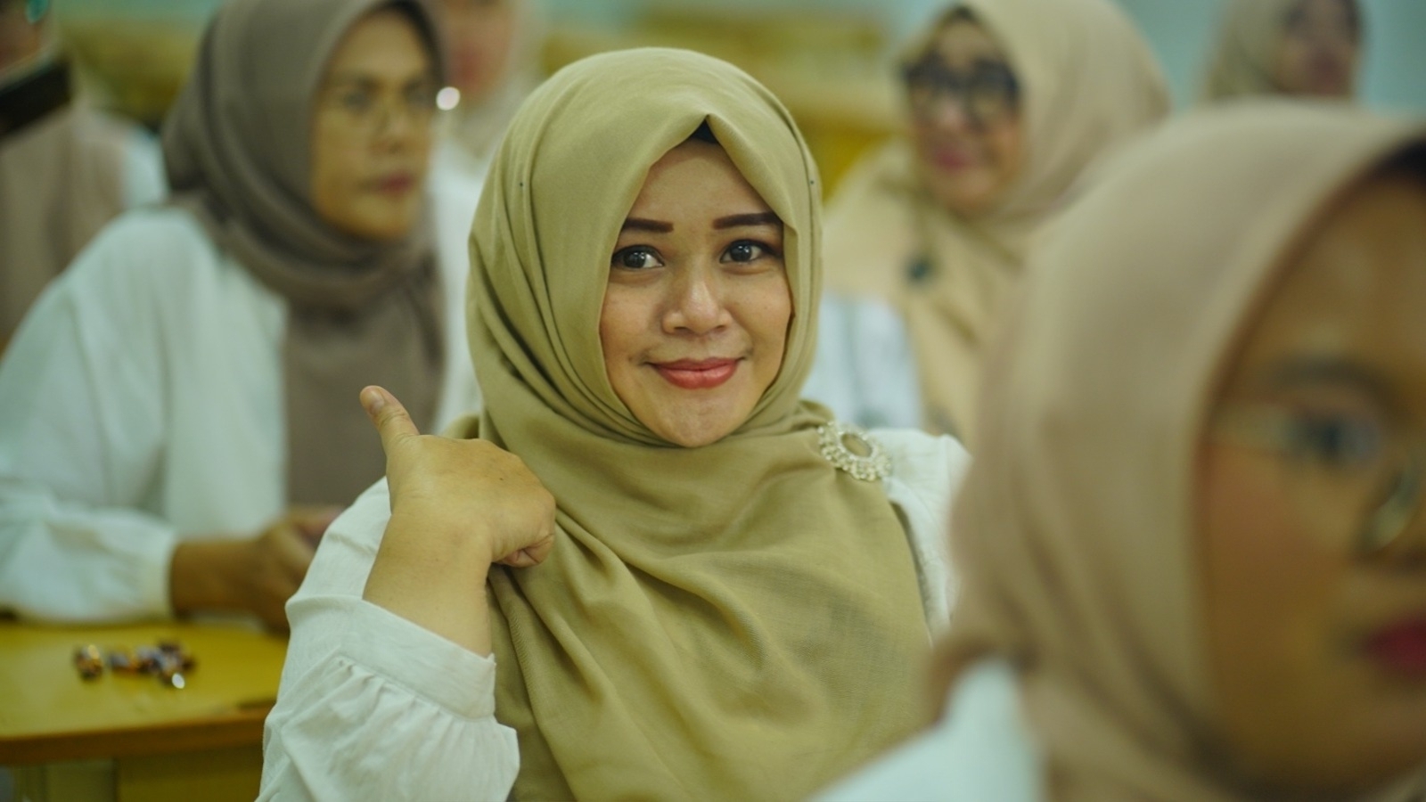 Nenden Retnawoelan Sastraprawira, S.H., S.Pd.